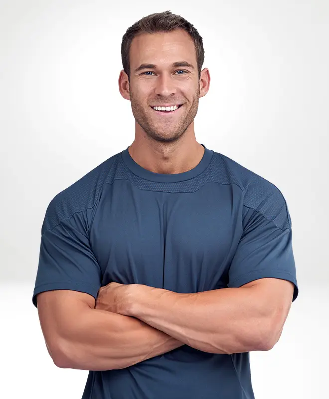Young muscular man smiling and posing with folded arms | Medical Gym | Internal Medicine Prime Care